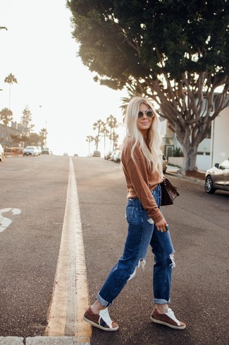 Brown Crew-neck Sweater · Blue Ripped Boyfriend Jeans · Brown Suede Low Top Sneakers · Brown Print Leather Satchel Bag · Dark Brown Sunglasses · Green Ring
